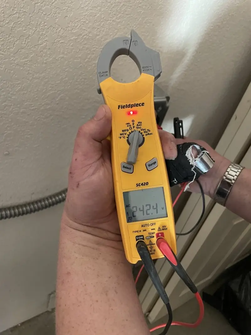 Voltage testing with clamp meter during Recessed Lighting Installation in Marlboro